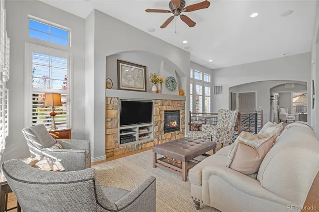 a living room with furniture and a fireplace