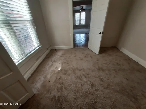 a view of an empty room and window