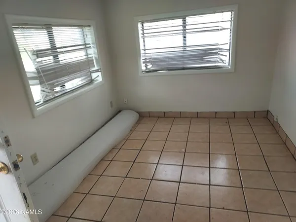 a view of empty room with windows