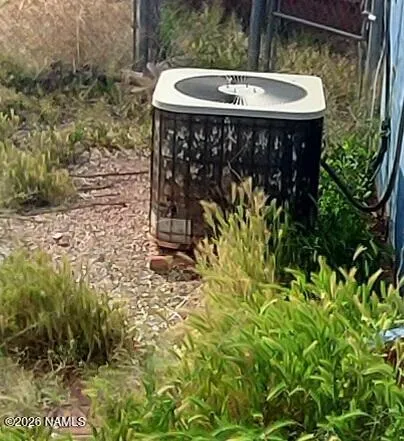 a view of a patio with table and chairs