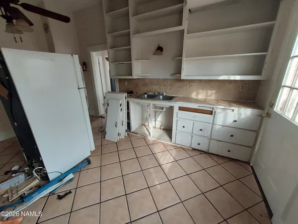 a kitchen with stainless steel appliances a stove and a refrigerator