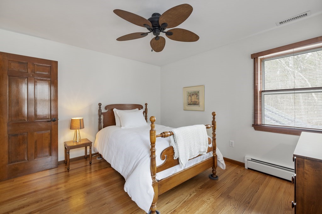 270 Middleton Road Boxford, MA 01921 - Photo 19 of 40 a bedroom with a bed and wooden floor