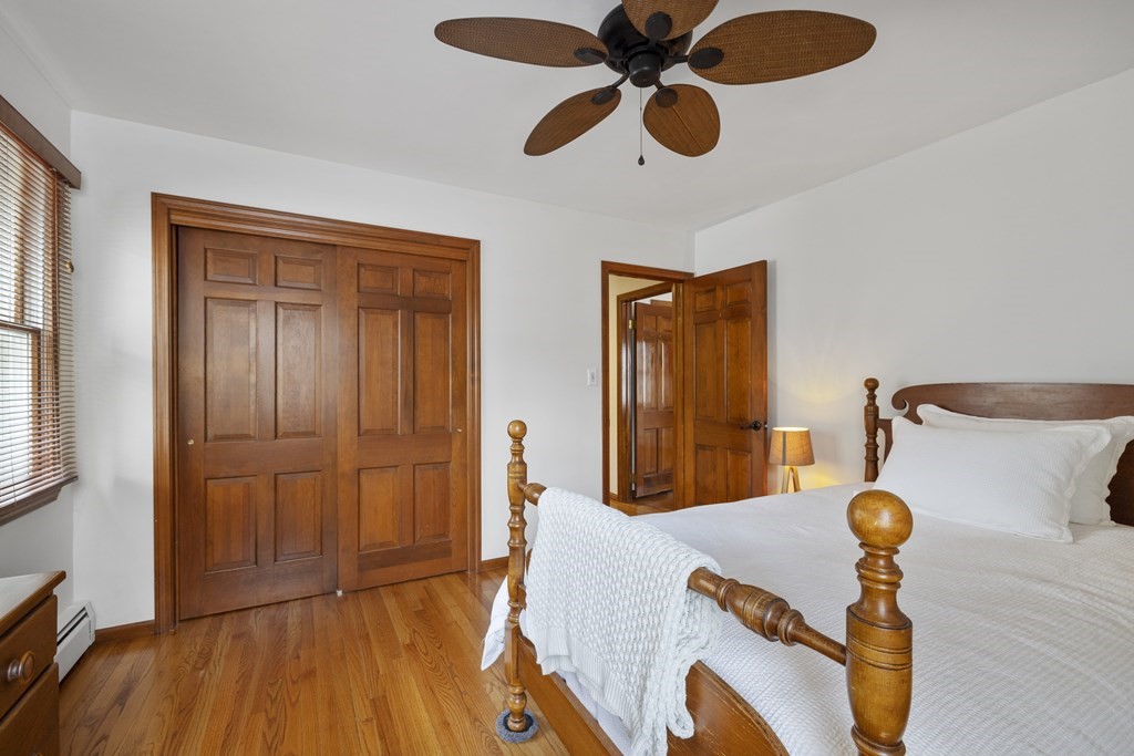 270 Middleton Road Boxford, MA 01921 - Photo 20 of 40 a bedroom with a bed and a chandelier