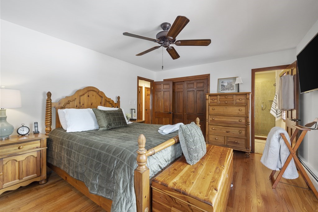 270 Middleton Road Boxford, MA 01921 - Photo 22 of 40 a bedroom with a bed and wooden floor