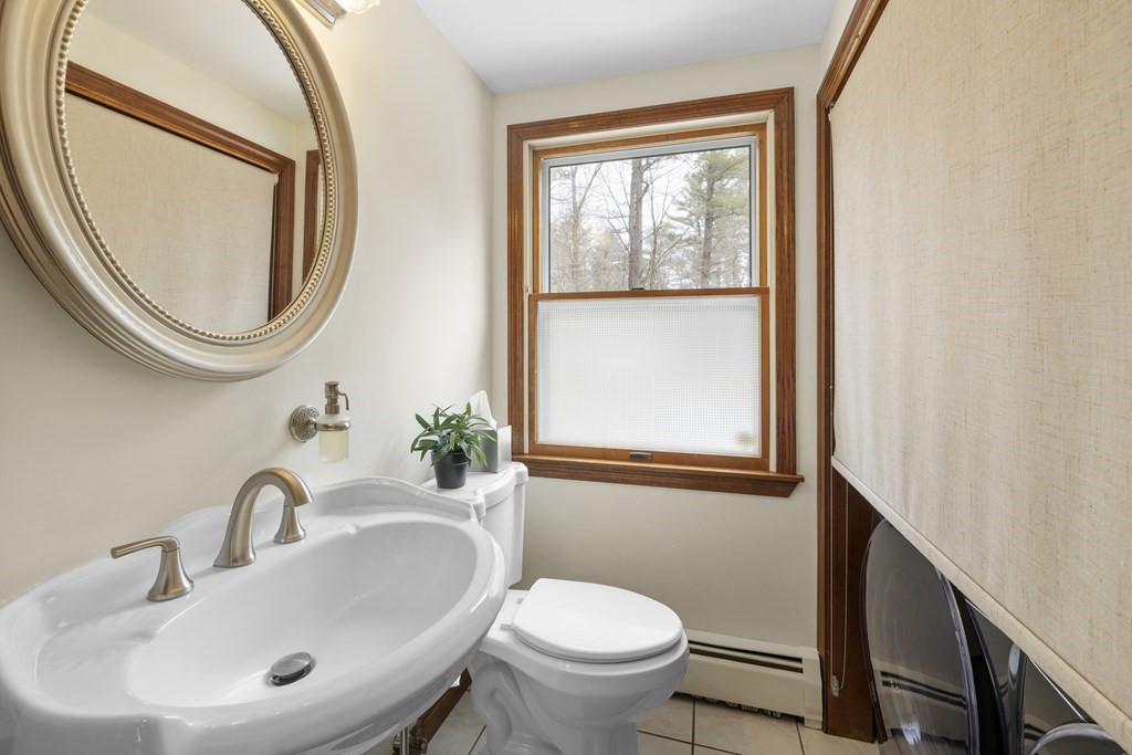 270 Middleton Road Boxford, MA 01921 - Photo 31 of 40 a bathroom with a toilet a sink and a mirror