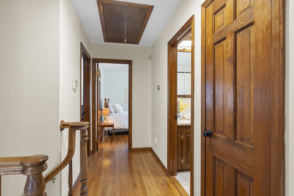 270 Middleton Road Boxford, MA 01921 - Photo 32 of 40 a hallway with wooden floor chandelier and entryway