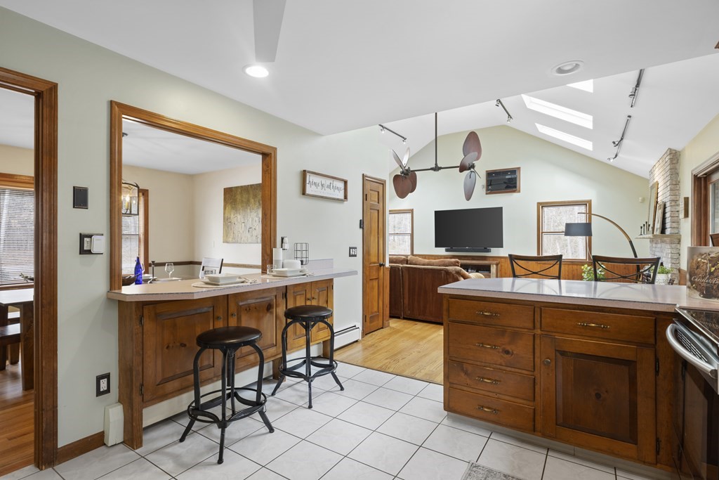 270 Middleton Road Boxford, MA 01921 - Photo 40 of 40 a view of a kitchen with kitchen island granite countertop wooden cabinets and stainless steel appliances