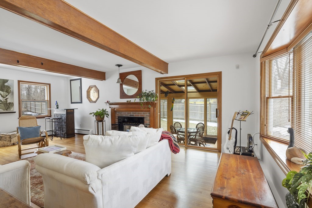 270 Middleton Road Boxford, MA 01921 - Photo 5 of 40 a living room with furniture large window and a fireplace