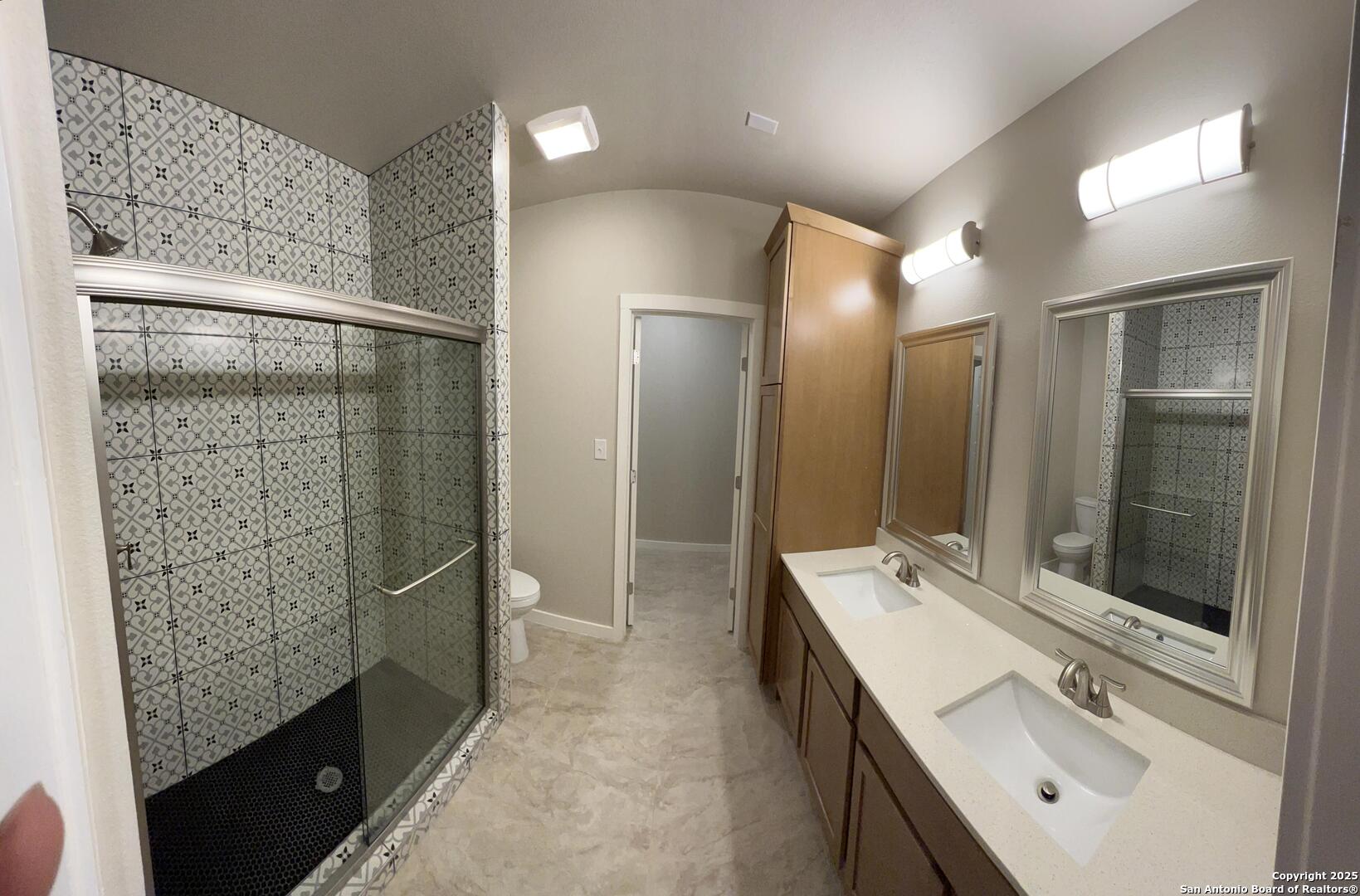 14743 Old Bandera Road, Unit 4 Helotes, TX 78023 - Photo 7 of 7 a bathroom with a double vanity sink mirror and shower