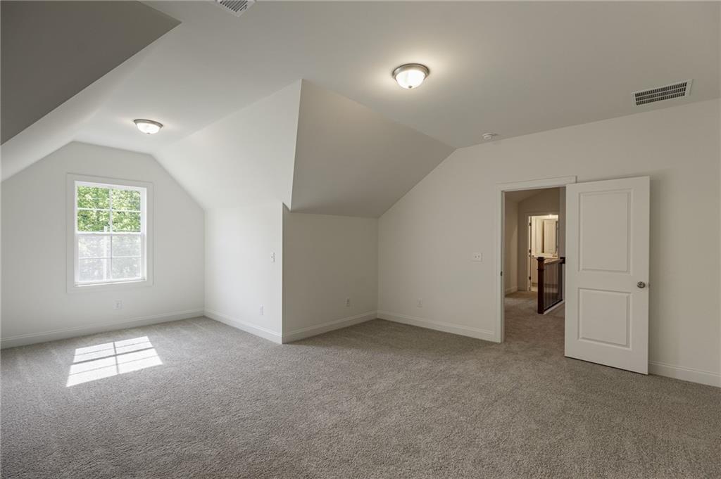 1210 Austin Road Winder, GA 30680 - Photo 43 of 56 an empty room with windows and closet