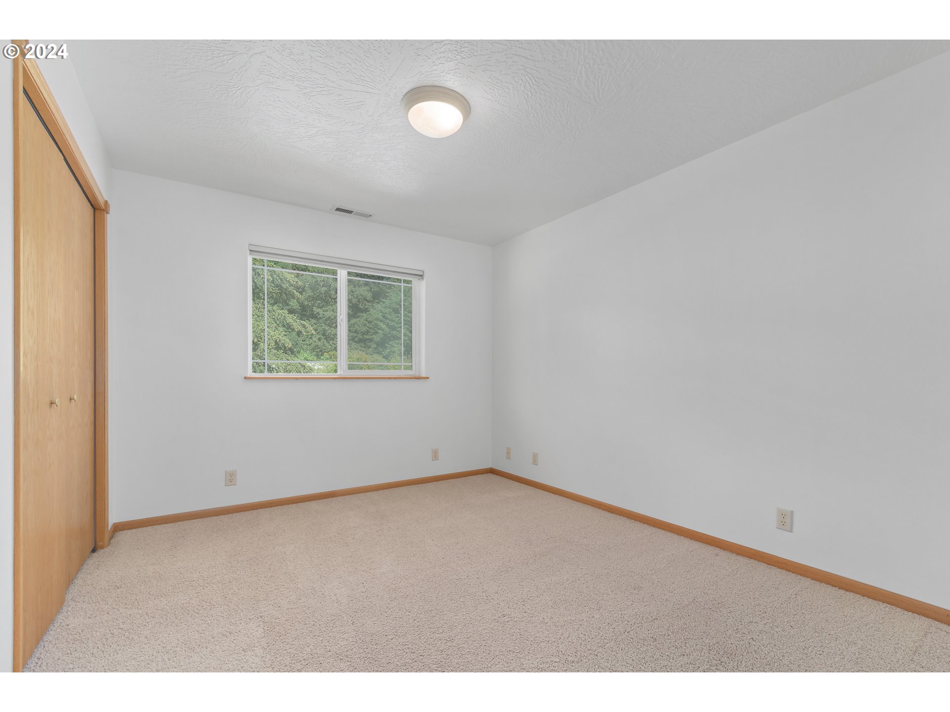 89584 Demming Road Elmira, OR 97437 - Photo 21 of 32 a view of an empty room with a window
