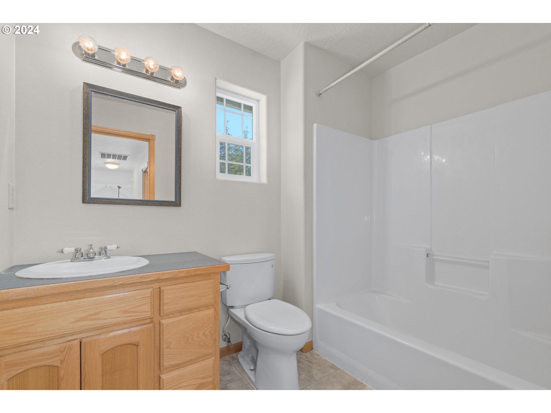 89584 Demming Road Elmira, OR 97437 - Photo 23 of 32 a bathroom with a toilet a sink and mirror