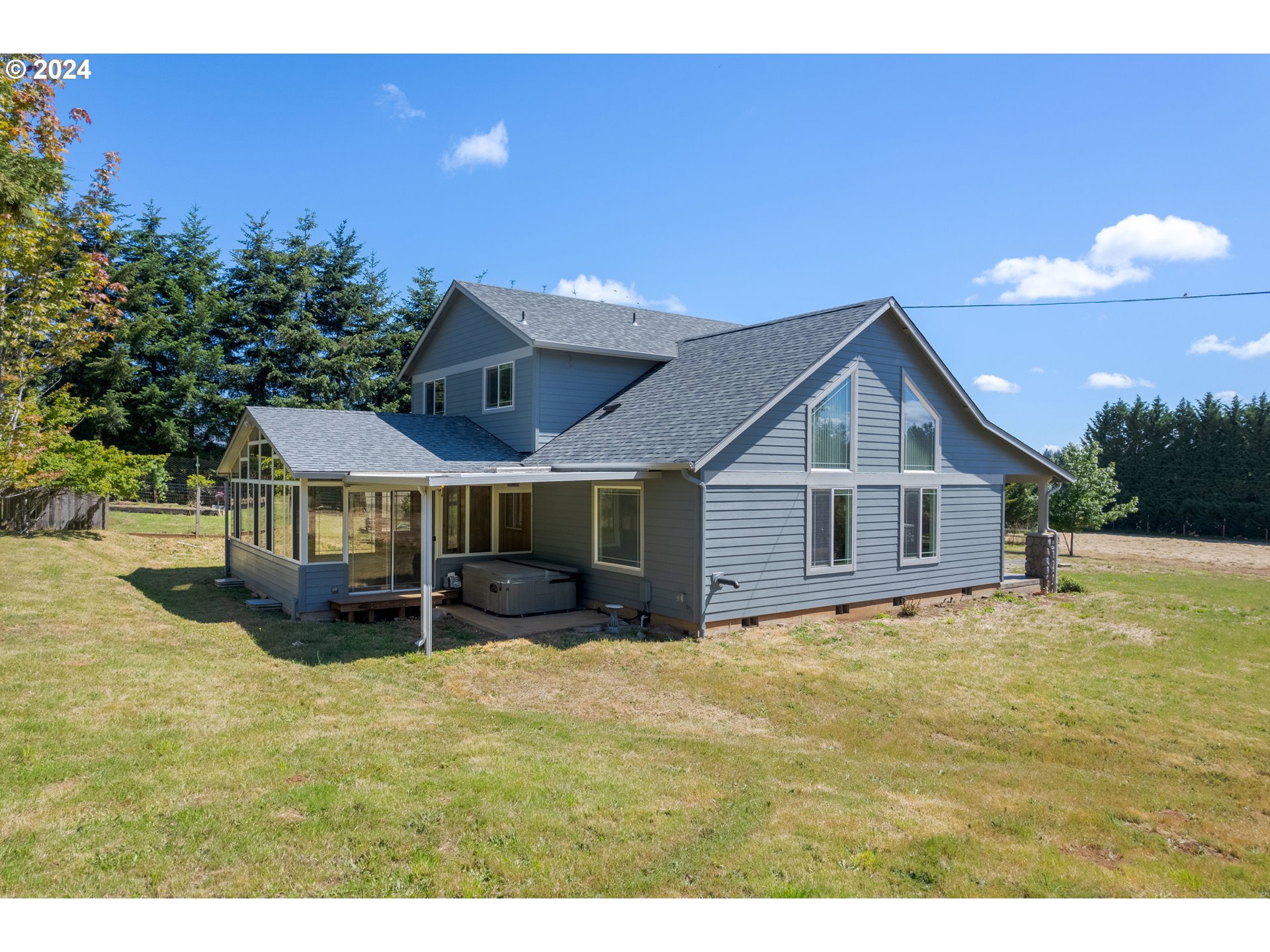 89584 Demming Road Elmira, OR 97437 - Photo 26 of 32 a view of a house with patio and a yard
