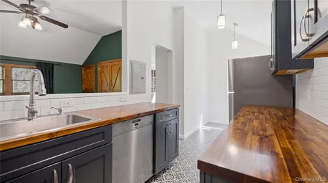 a bathroom with a sink a large mirror and vanity
