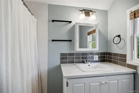 a sink with a mirror