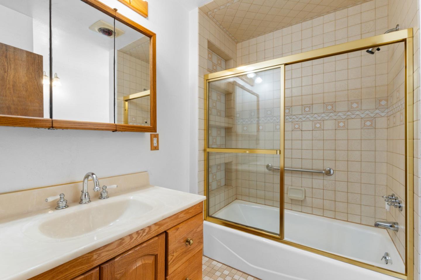 720 Alta Vista Drive Pacifica, CA 94044 - Photo 16 of 40 a bathroom with a sink and a shower