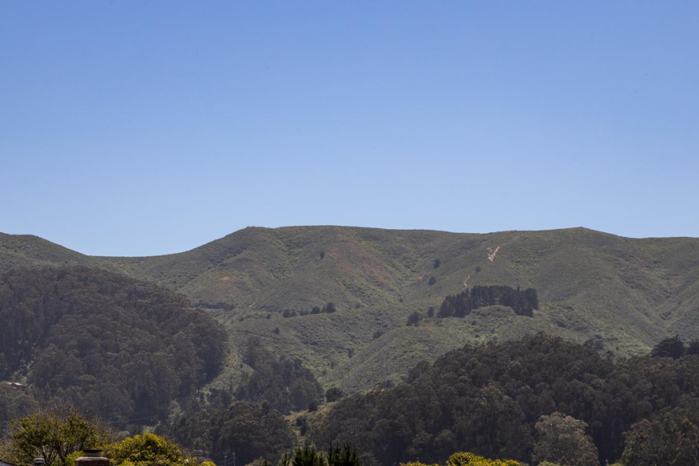 720 Alta Vista Drive Pacifica, CA 94044 - Photo 23 of 40 a view of a mountain range in a field