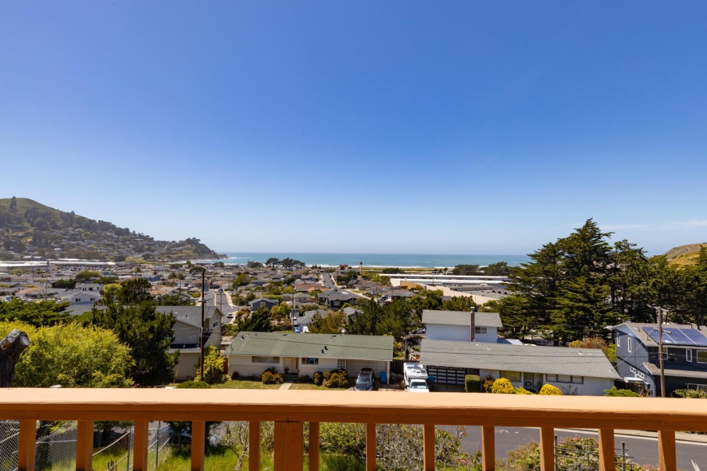 720 Alta Vista Drive Pacifica, CA 94044 - Photo 3 of 40 a view of a city from a balcony