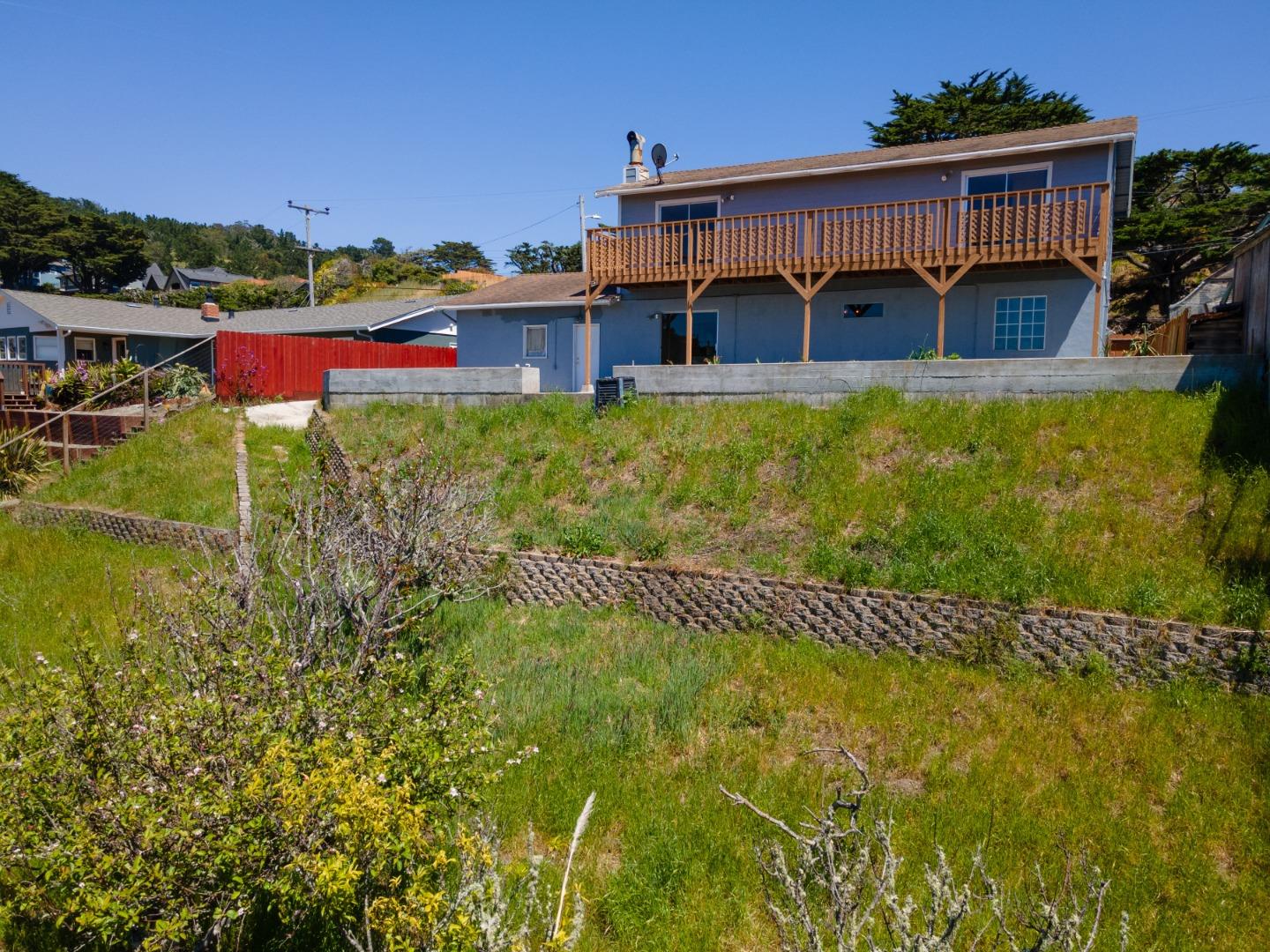 720 Alta Vista Drive Pacifica, CA 94044 - Photo 31 of 40 a view of a house with a yard