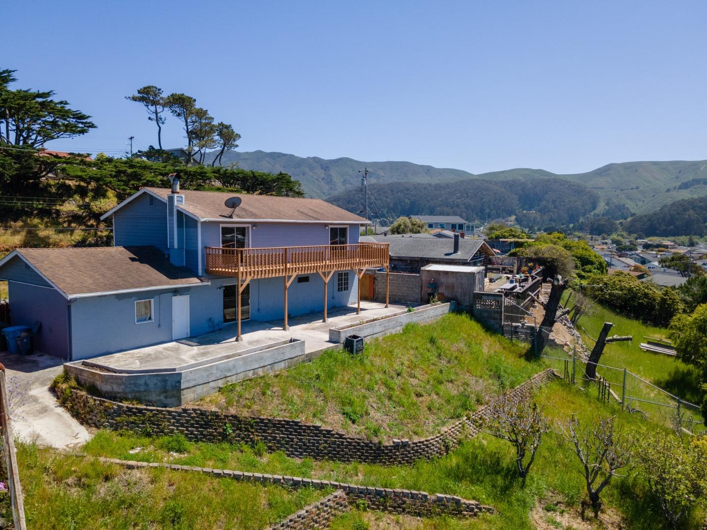 720 Alta Vista Drive Pacifica, CA 94044 - Photo 36 of 40 a view of a house with pool and a yard