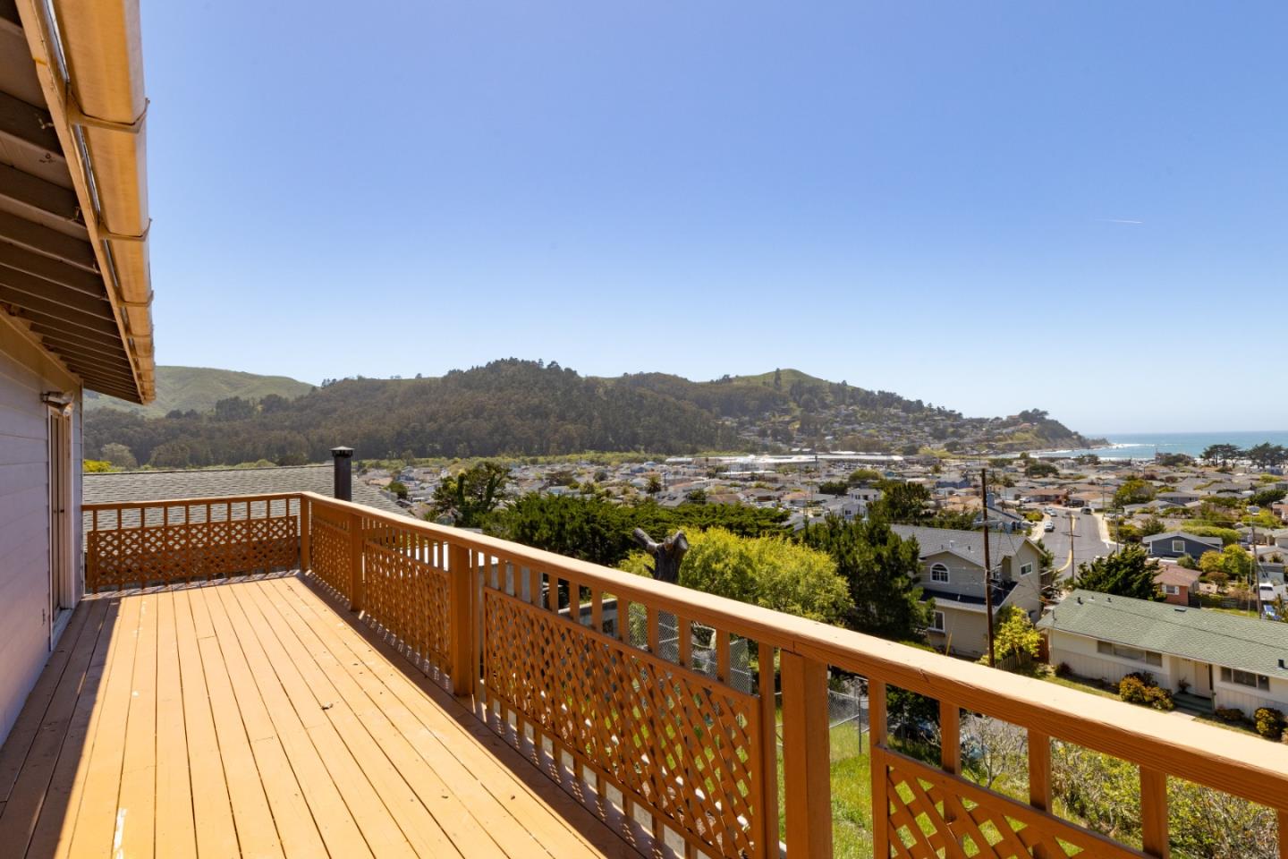 720 Alta Vista Drive Pacifica, CA 94044 - Photo 7 of 40 a view of a balcony with wooden floor and lake view