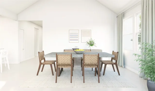 a dining room with furniture and window
