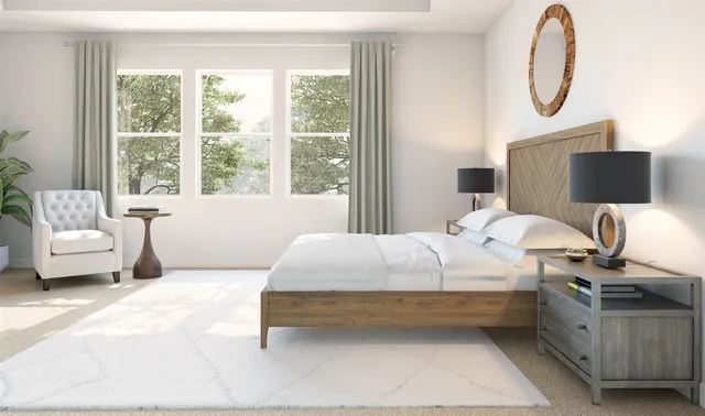 a bedroom with bed couch and a window