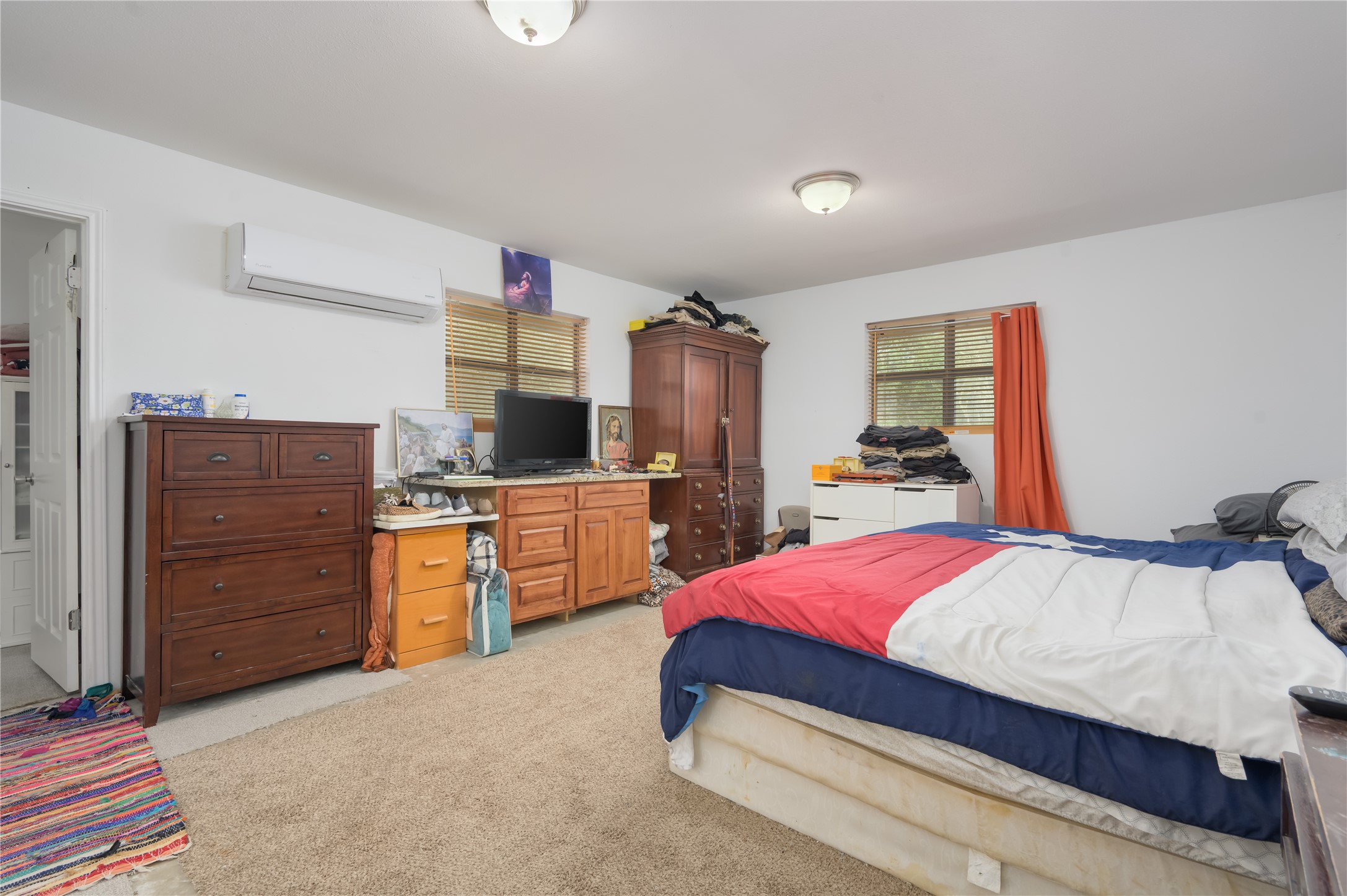 368 Lytton Lane Dale, TX 78616 - Photo 17 of 29 Bedroom featuring light colored carpet and an AC wall unit
