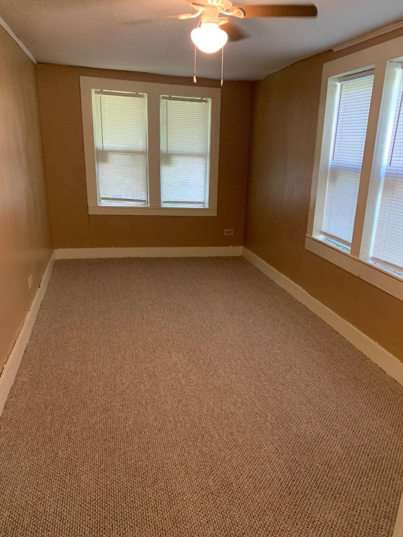 110 Peeples Street Navasota, TX 77868 - Photo 5 of 7 an empty room with a window