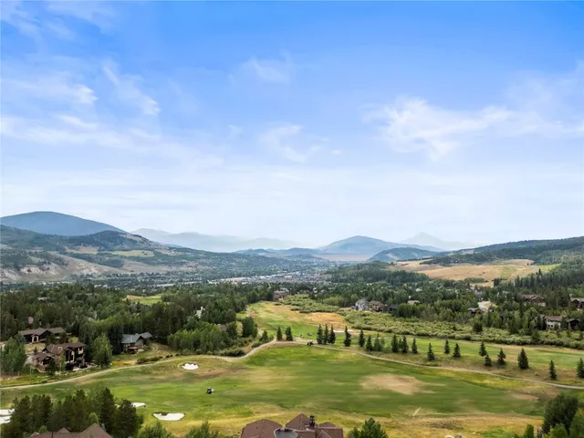 a view of a town with mountains in the background