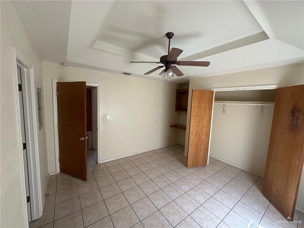 901 English Avenue, Unit 3 Edinburg, TX 78541 - Photo 5 of 9 an empty room with closet and a ceiling fan