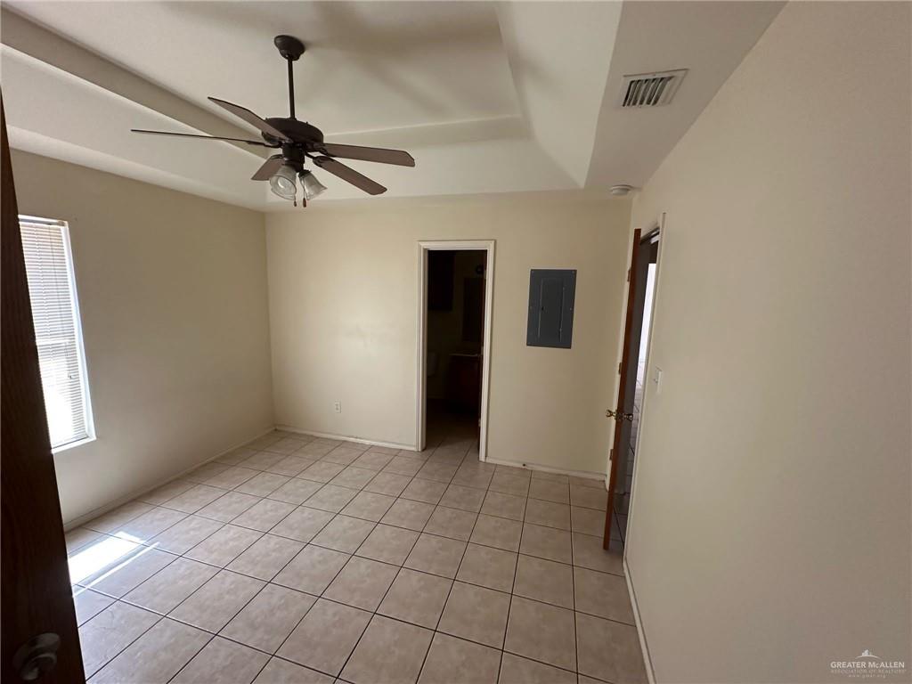 901 English Avenue, Unit 3 Edinburg, TX 78541 - Photo 6 of 9 a view of a livingroom with a chandelier fan and wooden floor