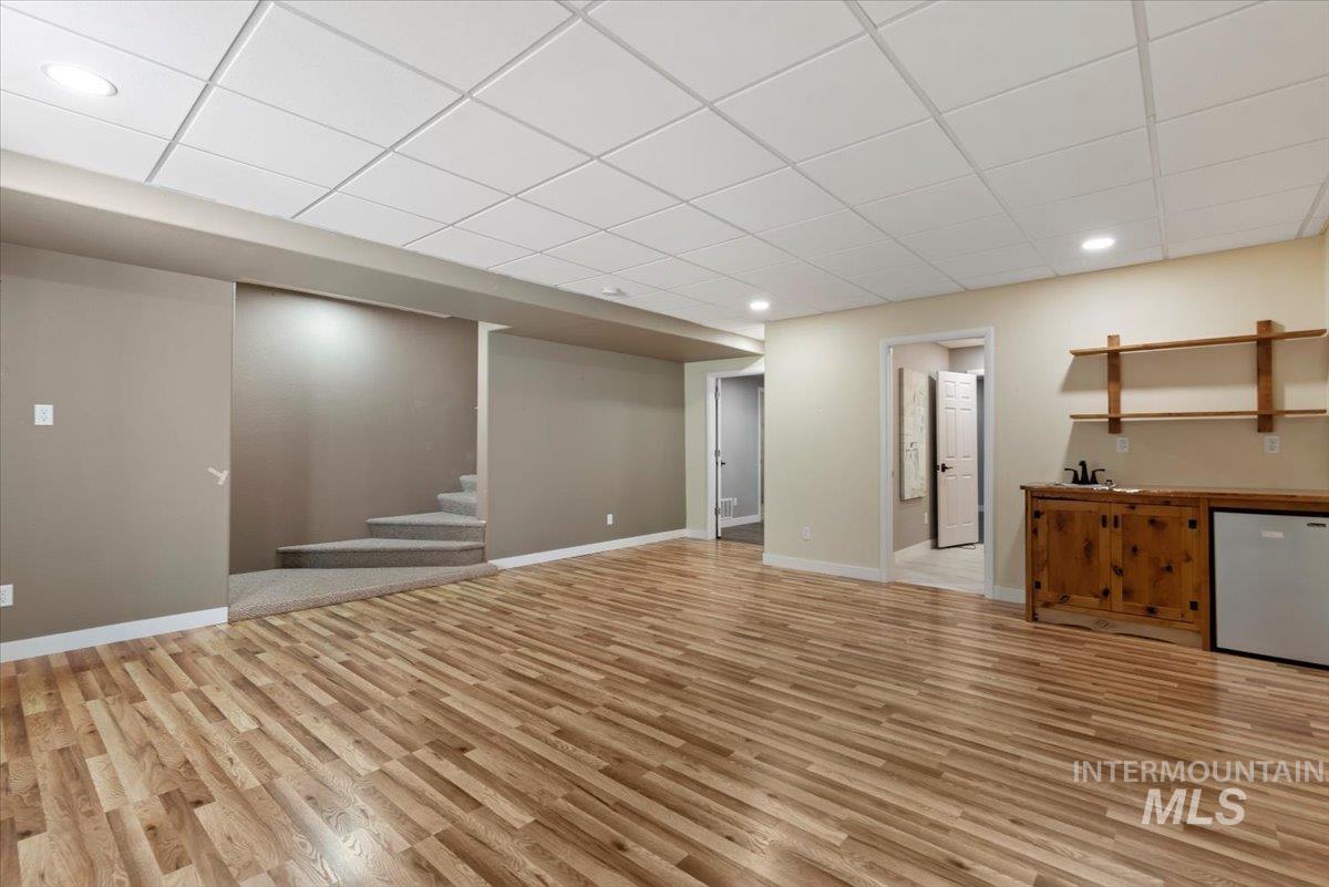 147 East Indian Crk Road Boise, ID 83716 - Photo 26 of 43 Spacious finished lower level featuring wood-finish flooring, recessed lighting, and a drop ceiling