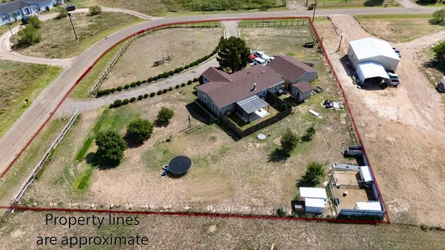 an aerial view of a house with a swimming pool