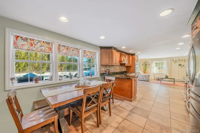 a view of a dining room with furniture window and outside view