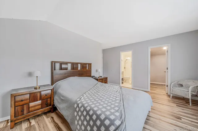 a bedroom with a bed and a view of bathroom