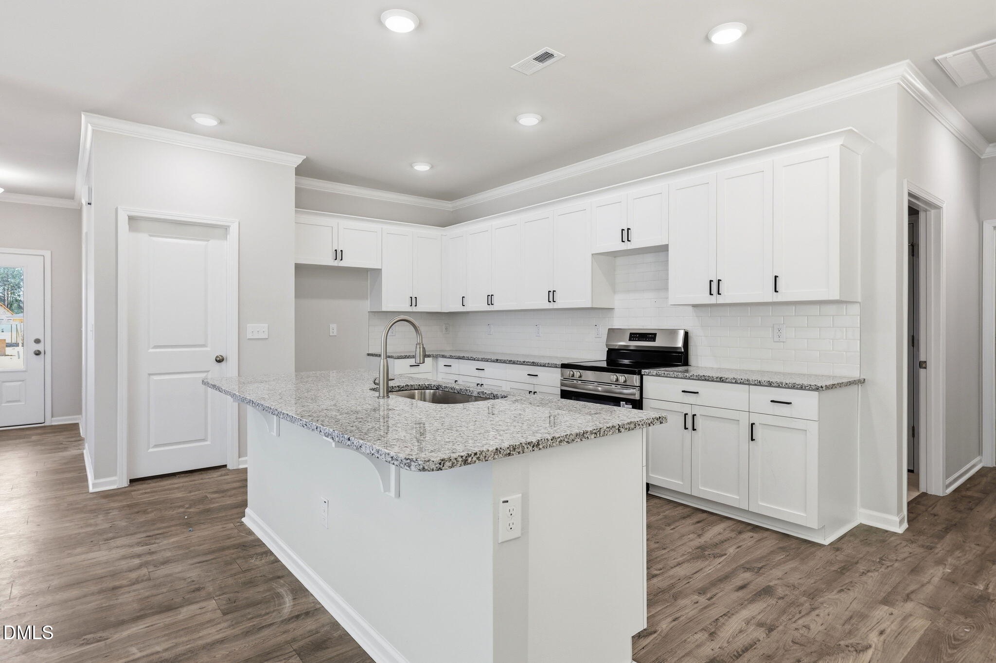 191 Nectar Lane Bunnlevel, NC 28323 - Photo 10 of 35 a kitchen with granite countertop white cabinets and a granite counter tops