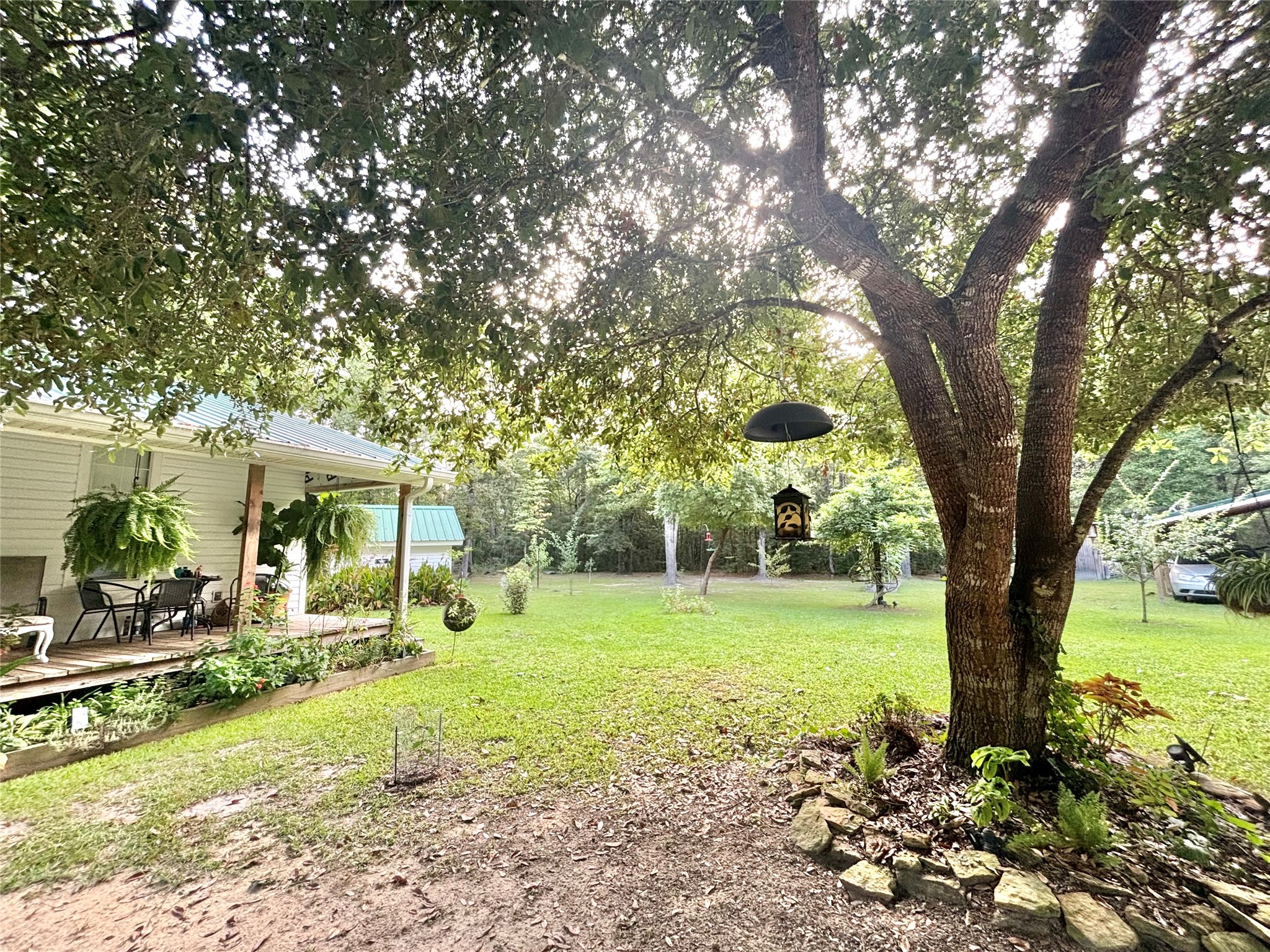 516 County Road 4800 Warren, TX 77664 - Photo 8 of 50 a front view of a house with a yard and trees