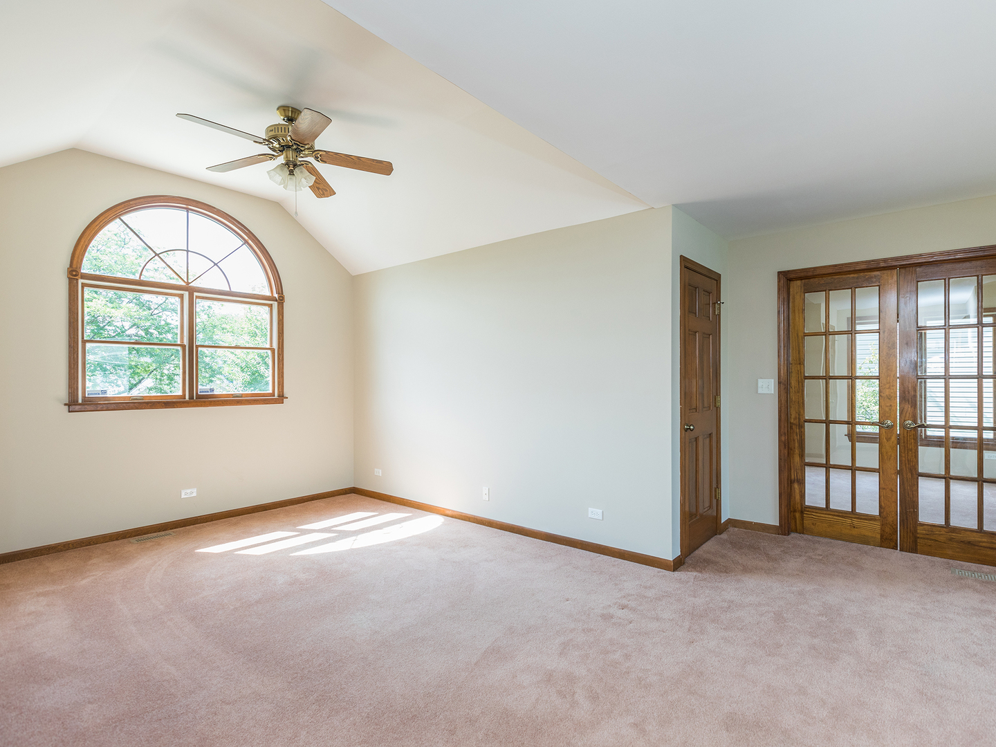 872 New Britton Road Carol Stream, IL 60188 - Photo 11 of 22 an empty room with windows and ceiling fan