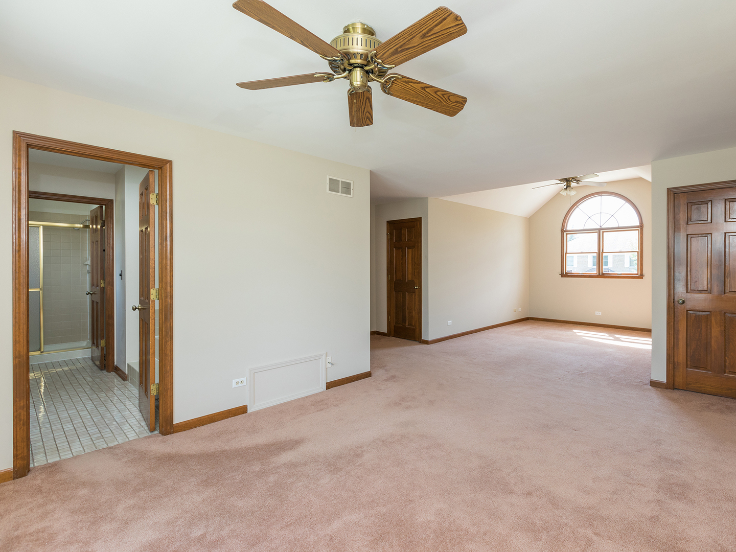 872 New Britton Road Carol Stream, IL 60188 - Photo 12 of 22 an empty room with chandelier fan and windows