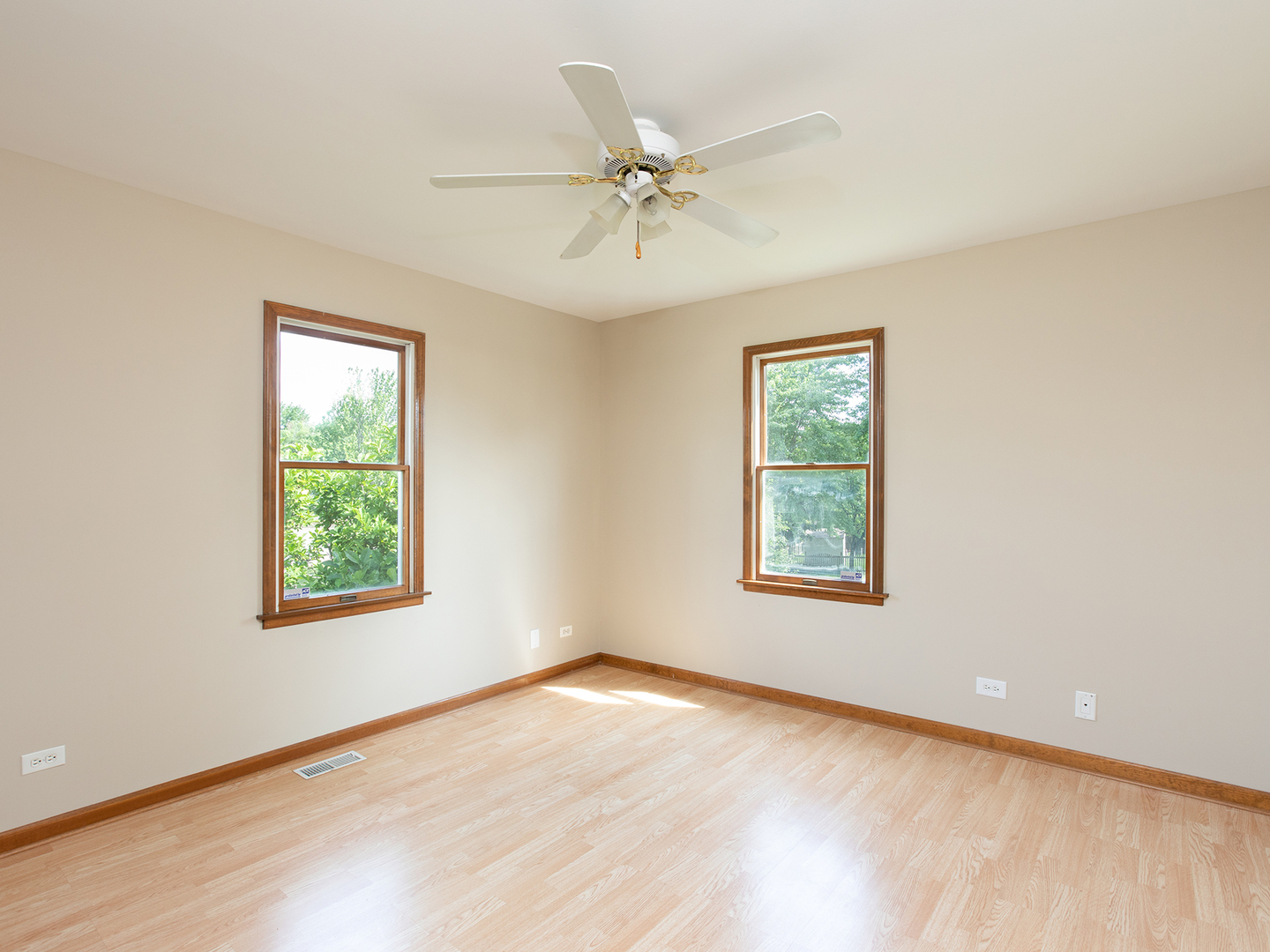 872 New Britton Road Carol Stream, IL 60188 - Photo 16 of 22 an empty room with a window and a ceiling fan