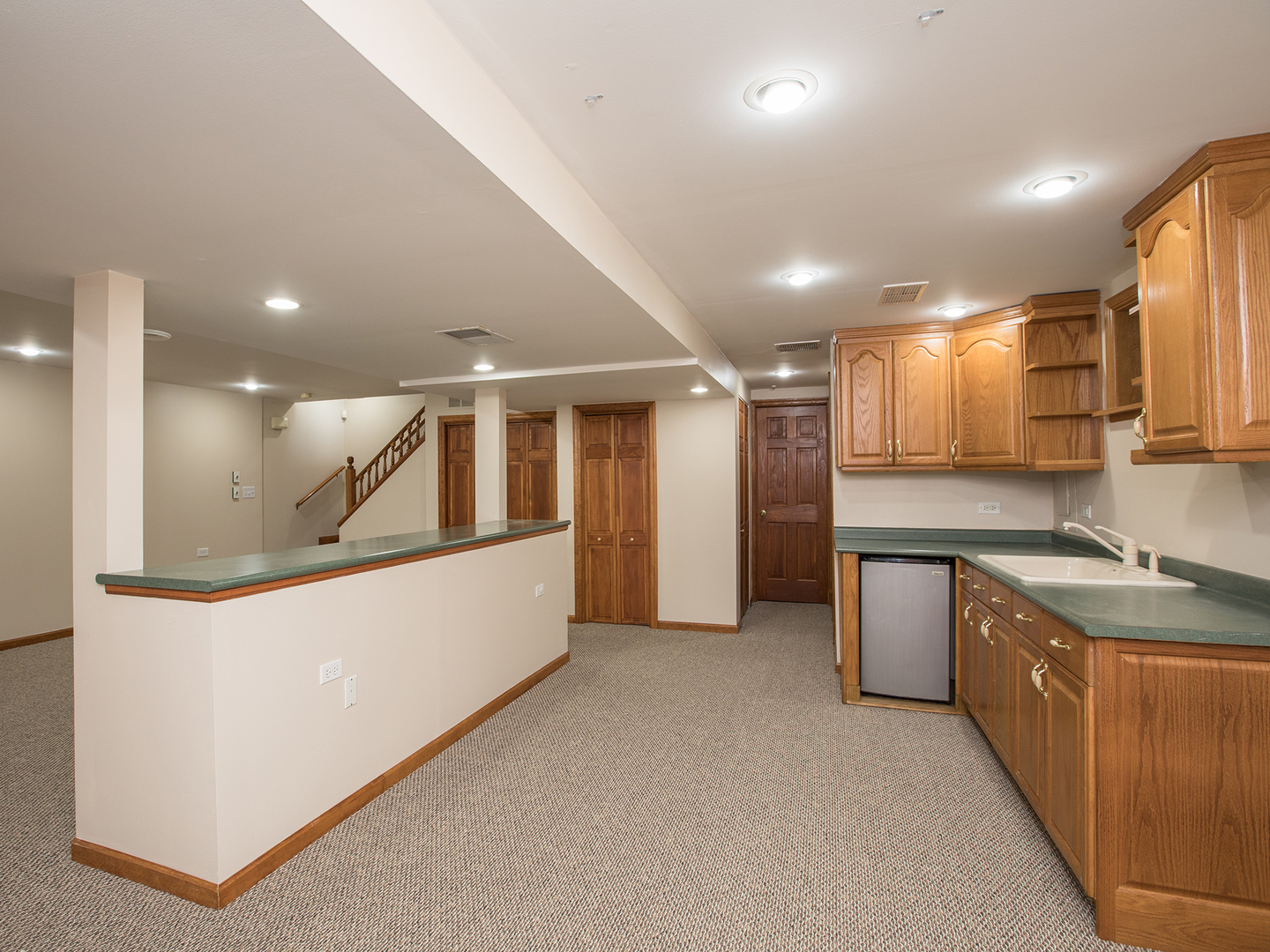 872 New Britton Road Carol Stream, IL 60188 - Photo 18 of 22 a large kitchen with stainless steel appliances kitchen island a large counter top and a sink