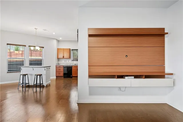 a view of room with furniture and wooden floor