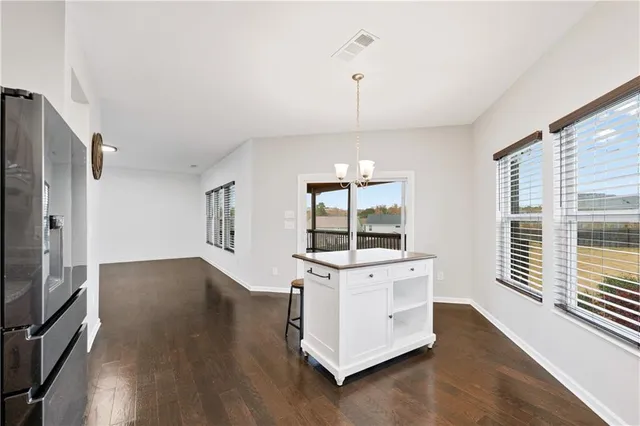 a kitchen with stainless steel appliances granite countertop a stove and a refrigerator