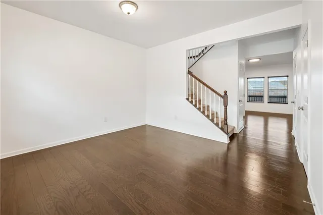 a view of an entryway with wooden floor