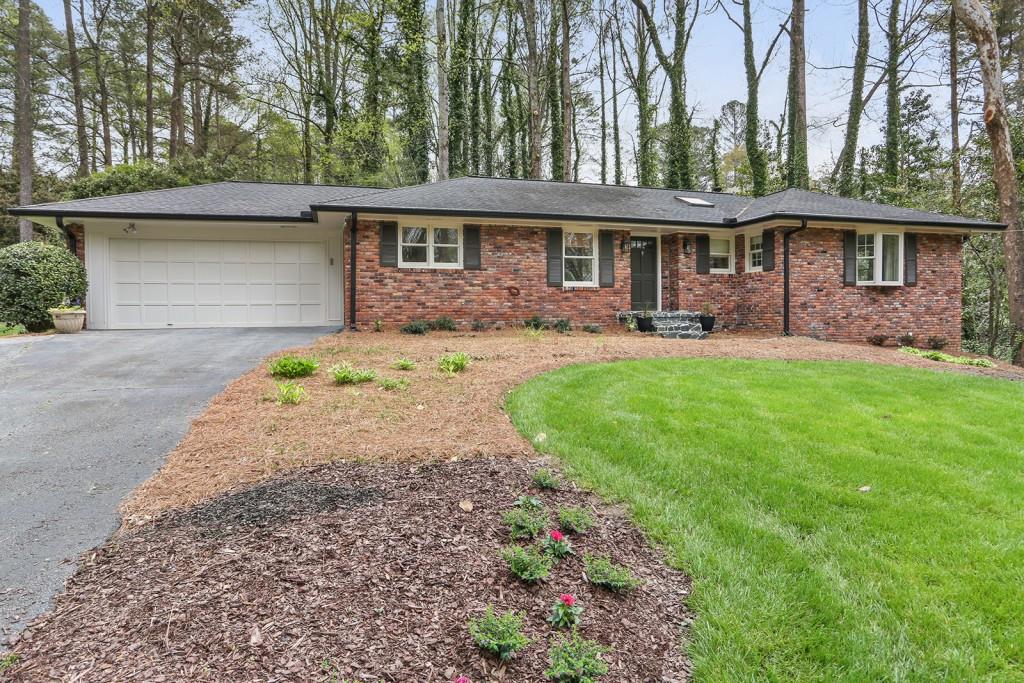 6405 Colebridge Road Northwest Atlanta, GA 30328 - Photo 1 of 1 Wonderful updated all brick ranch with a full, finished basement.
