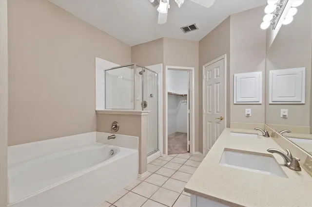 a bathroom with a bathtub and a sink