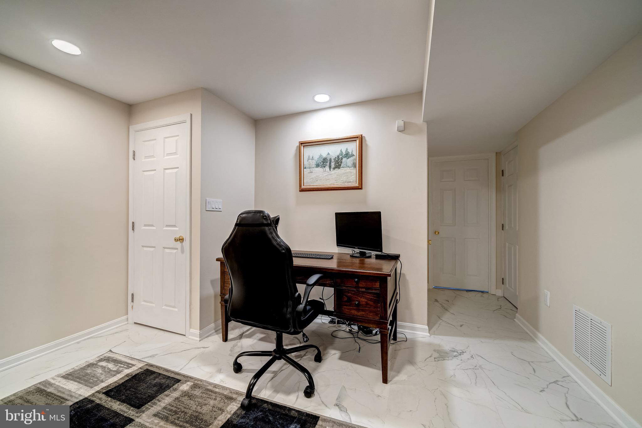 6042 Munson Hill Road Falls Church, VA 22044 - Photo 19 of 30 a view of a workspace with furniture and a window