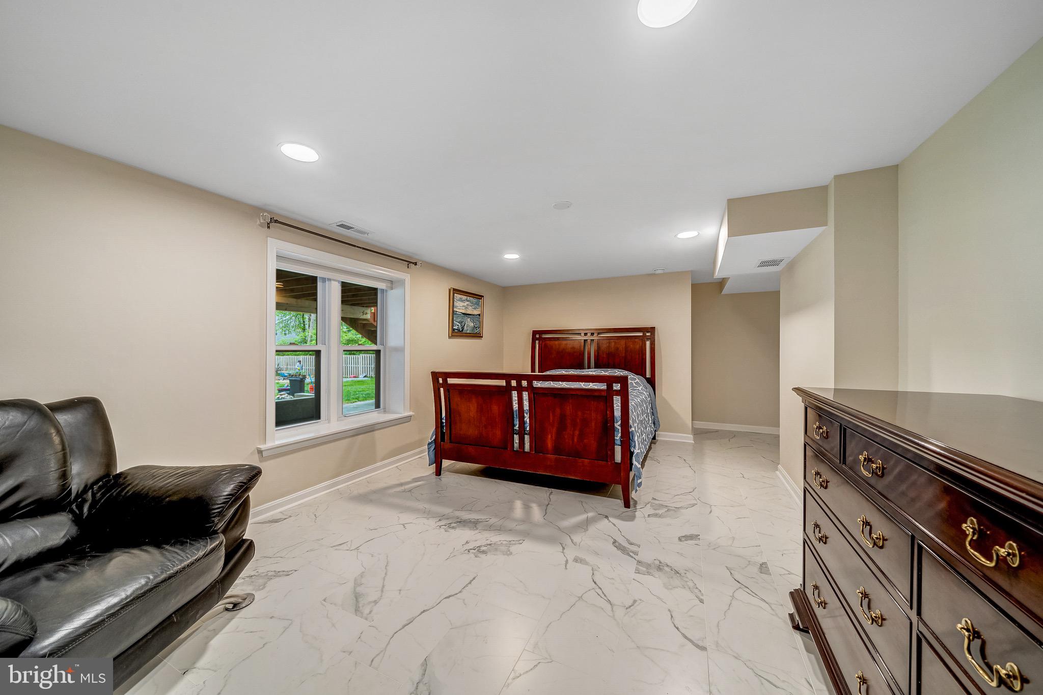 6042 Munson Hill Road Falls Church, VA 22044 - Photo 25 of 30 a living room with furniture a window and a flat screen tv