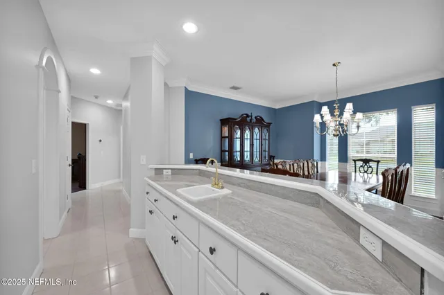 a view of a house with swimming pool and porch